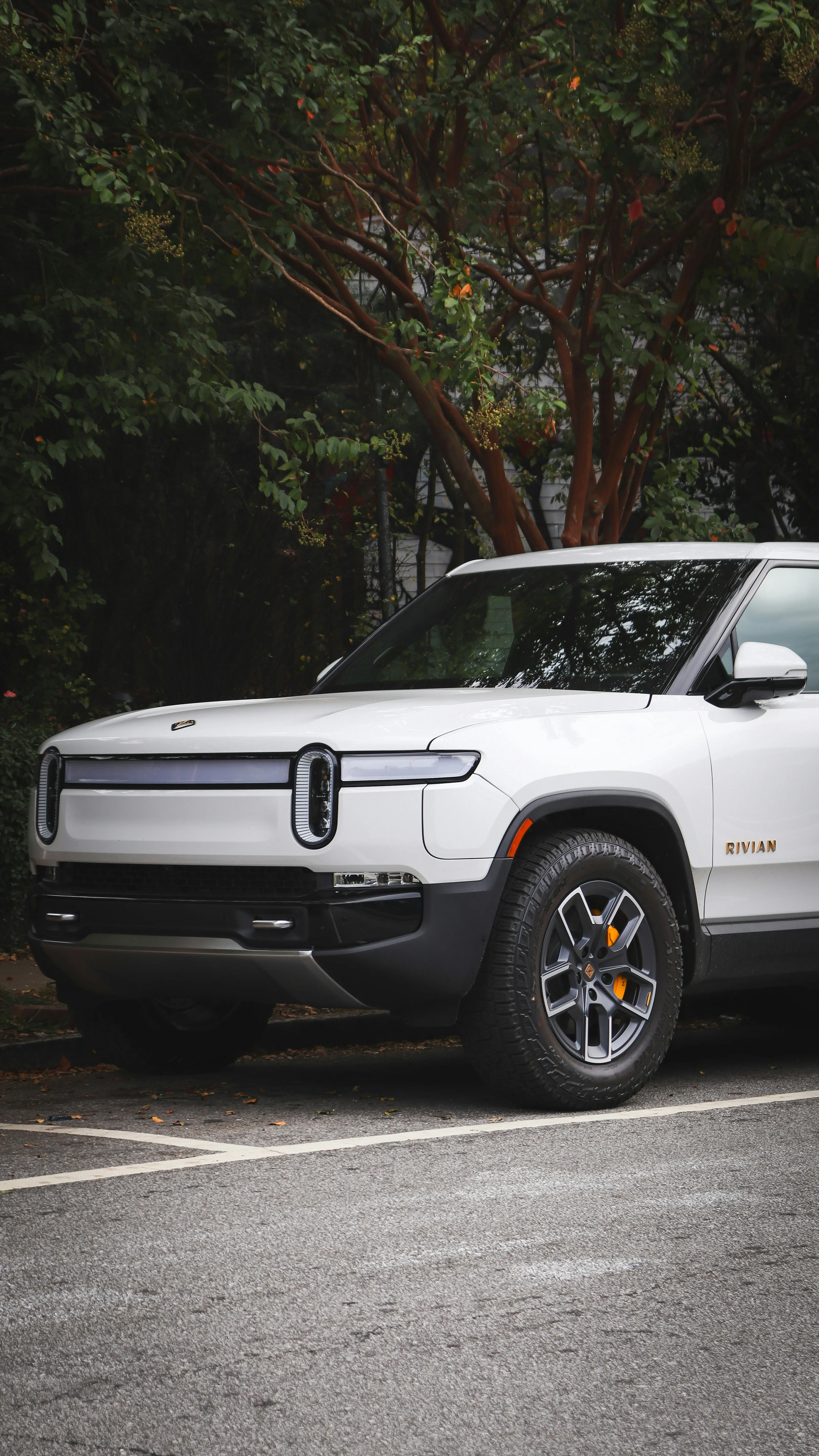 White Rivian R1T front three-quarter view